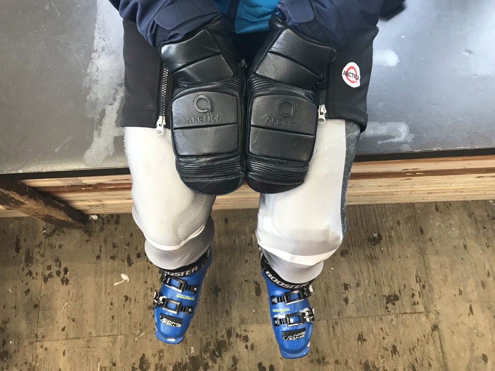 Ski racer in their Arctica race suit, shorts and mittens.