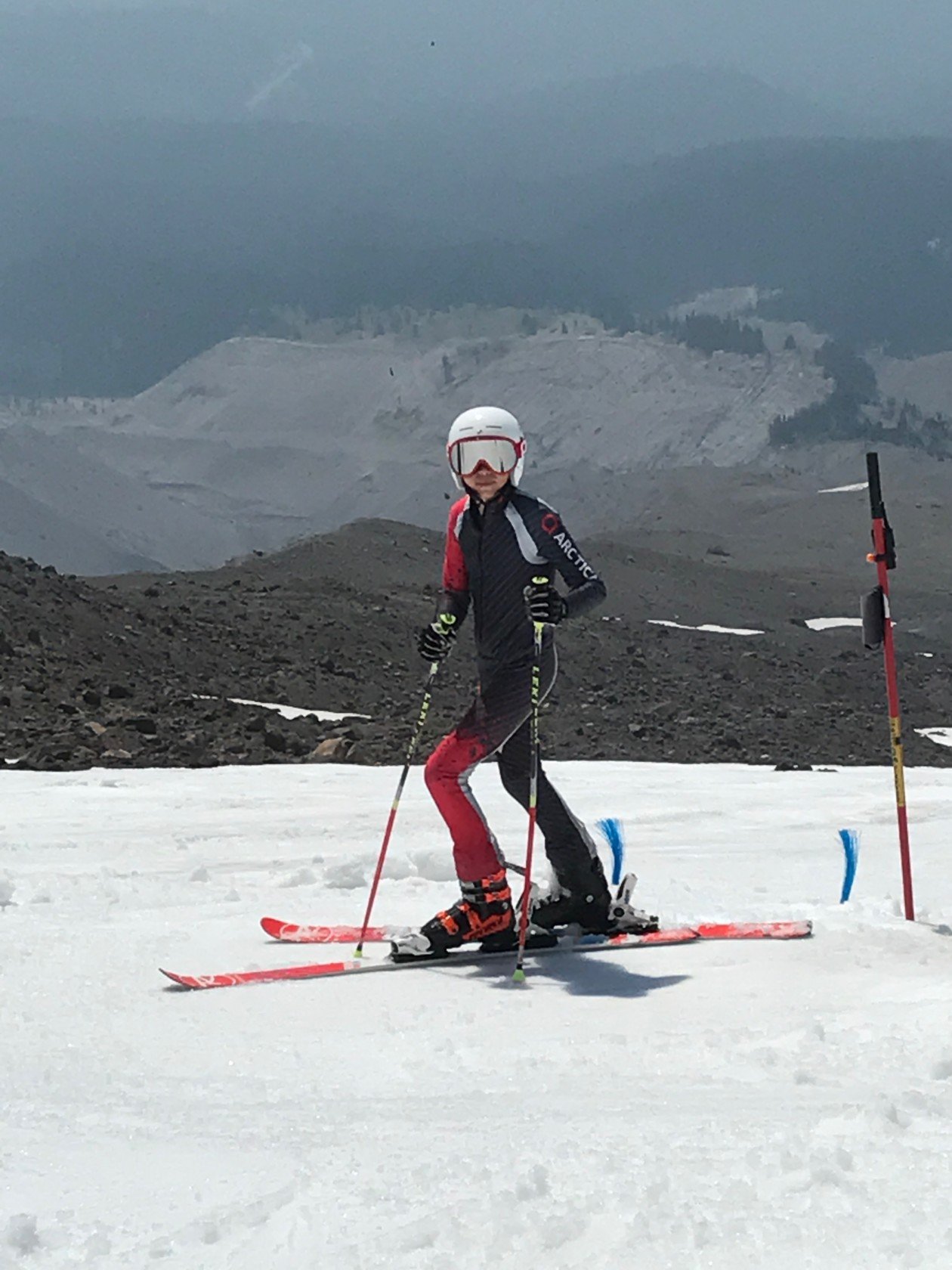 Young ski racer at Mt Hood wearing an essential items from his summer ski racing kit - a speed suit.