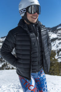 Male ski racer wearing and Arctica Featherlyte Hoody over a Featherlyte vest