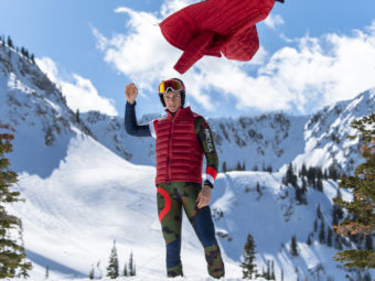 Man throwing off his Arctica Featherlyte PackHoodie to reveal his Arctica Packvest