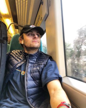 Myles Silverman on a train staring out the window pondering how COVID will affect his training and racing in 2020-21