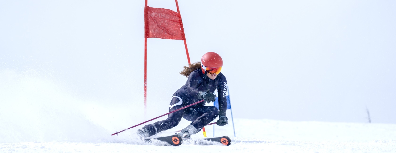 girl racing in Arctica Race Suit powered by NEXGEN