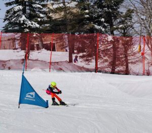 Ali Carving Turns in Ski Race with Arctica Pinnacle Suit