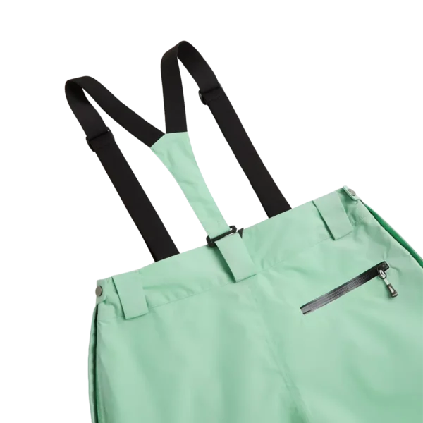 Close-up of the black suspenders and zip back pocket on the Arctica Adult Side Zip Pants 2.0 in Mint.