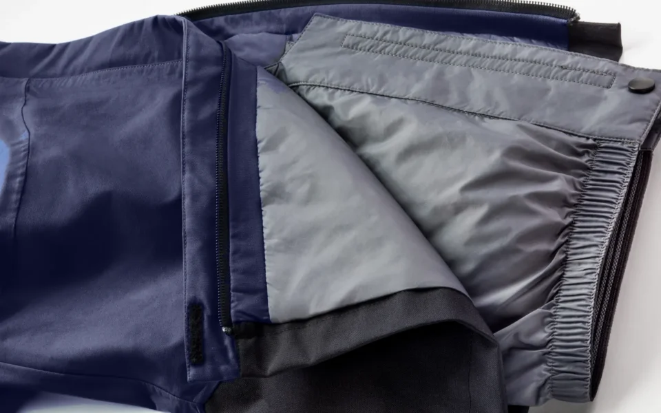 Close-up of the Arctica Side Zip Ski Pants 2.0 in Midnight opened to show the gray lining.