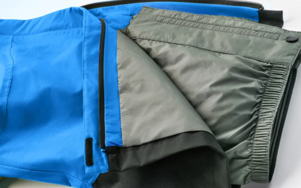 Close-up of the Arctica Side Zip Ski Pants 2.0 in Royal opened to show the gray lining.