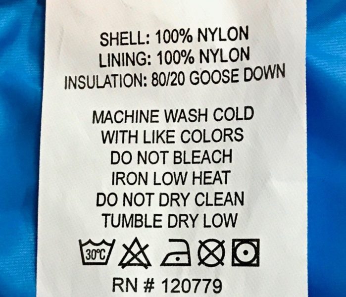 Fabric care label showing proper washing instructions for the Arctica Pinnacle Down Jacket , an 80/20 goose down ski jacket so you know how to wash your ski gear.