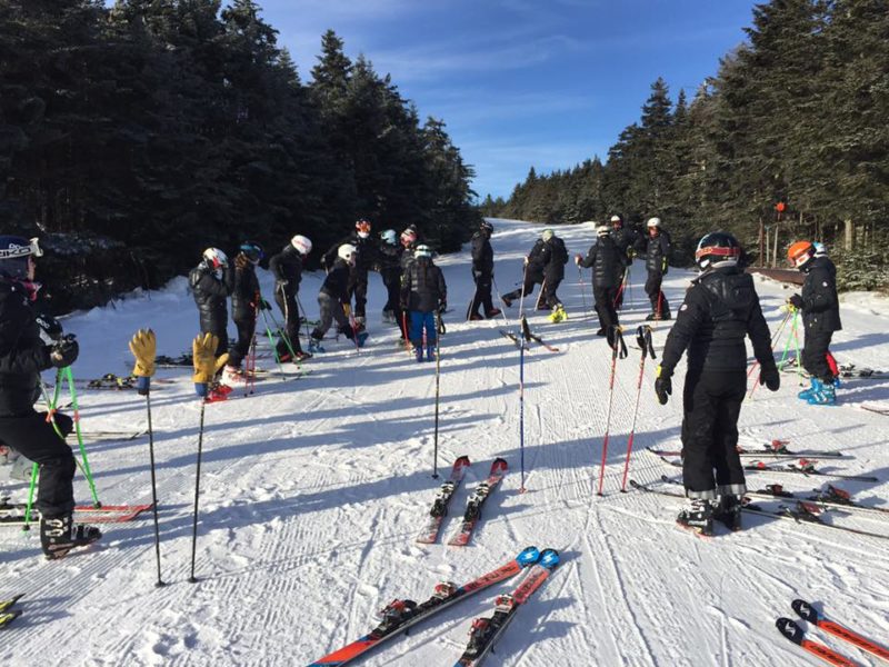 UConn Ski Team wearing their Arctica Pinnacle Down Training Jackets for ski race training. It is THE best down jacket for ski racers.